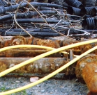 Yellow Tubes over Rusted Pipe